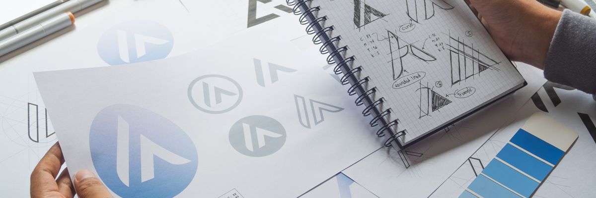 small business designer sketching logos and designs.