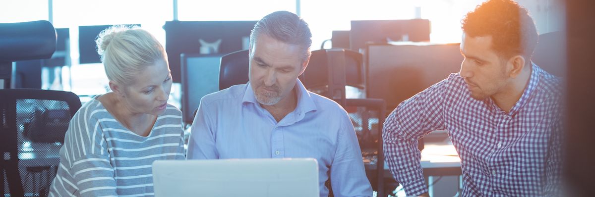 Business partners discussing at office desk in meeting