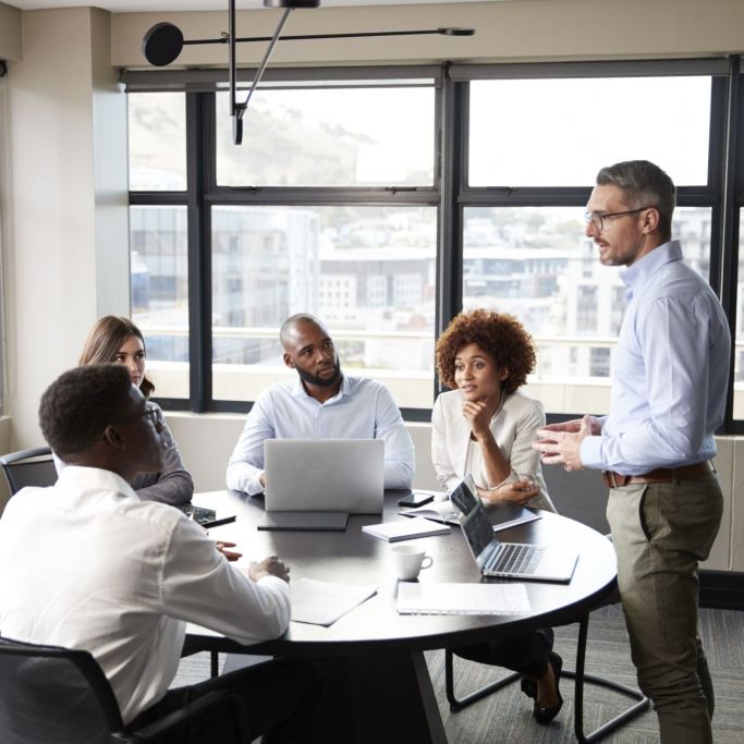 businessman addressing teammates in a meeting