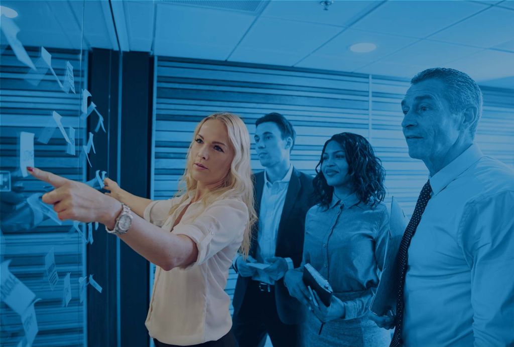 marketing director develops a strategy with a team